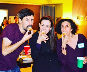 3 people biting into a canape